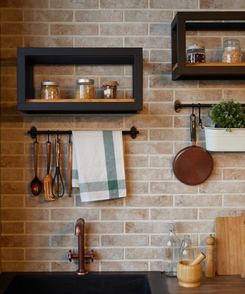 Vertical background image of kitchen interior with brick wall and rustic decor elements, copy space